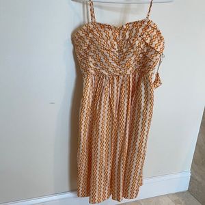 Cream colored dress with fun orange pattern